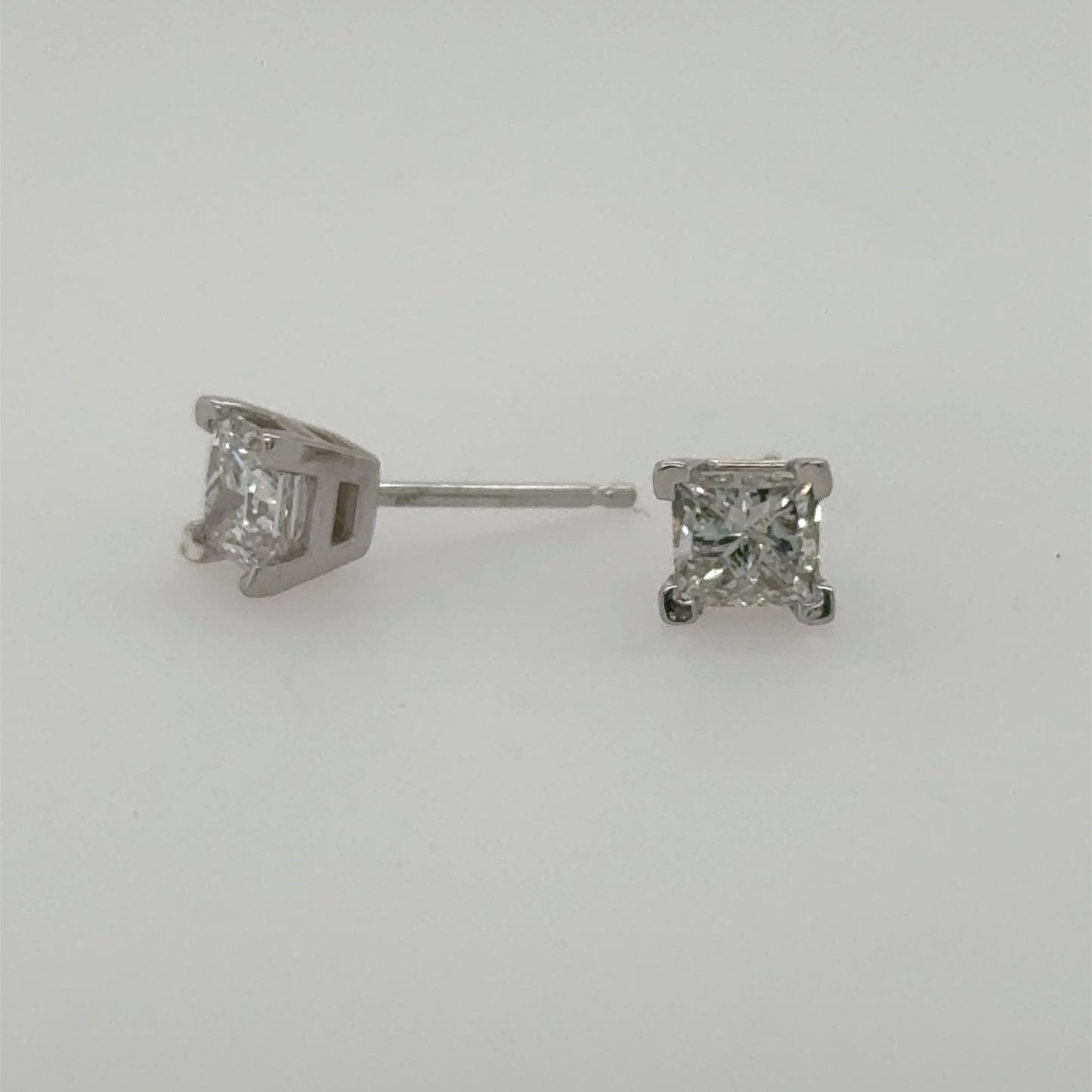 14K white gold stud earrings with princess-cut diamonds in four-prong settings.