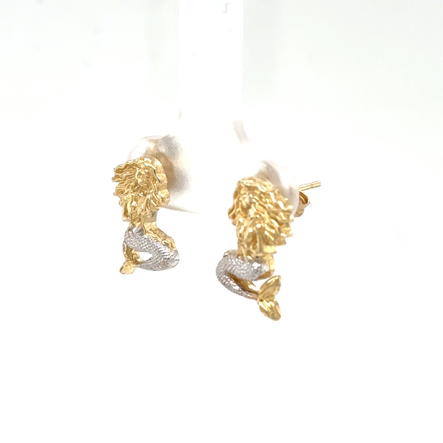 14K two-tone mermaid stud earrings, yellow gold bodies with rhodium-plated silver tails.