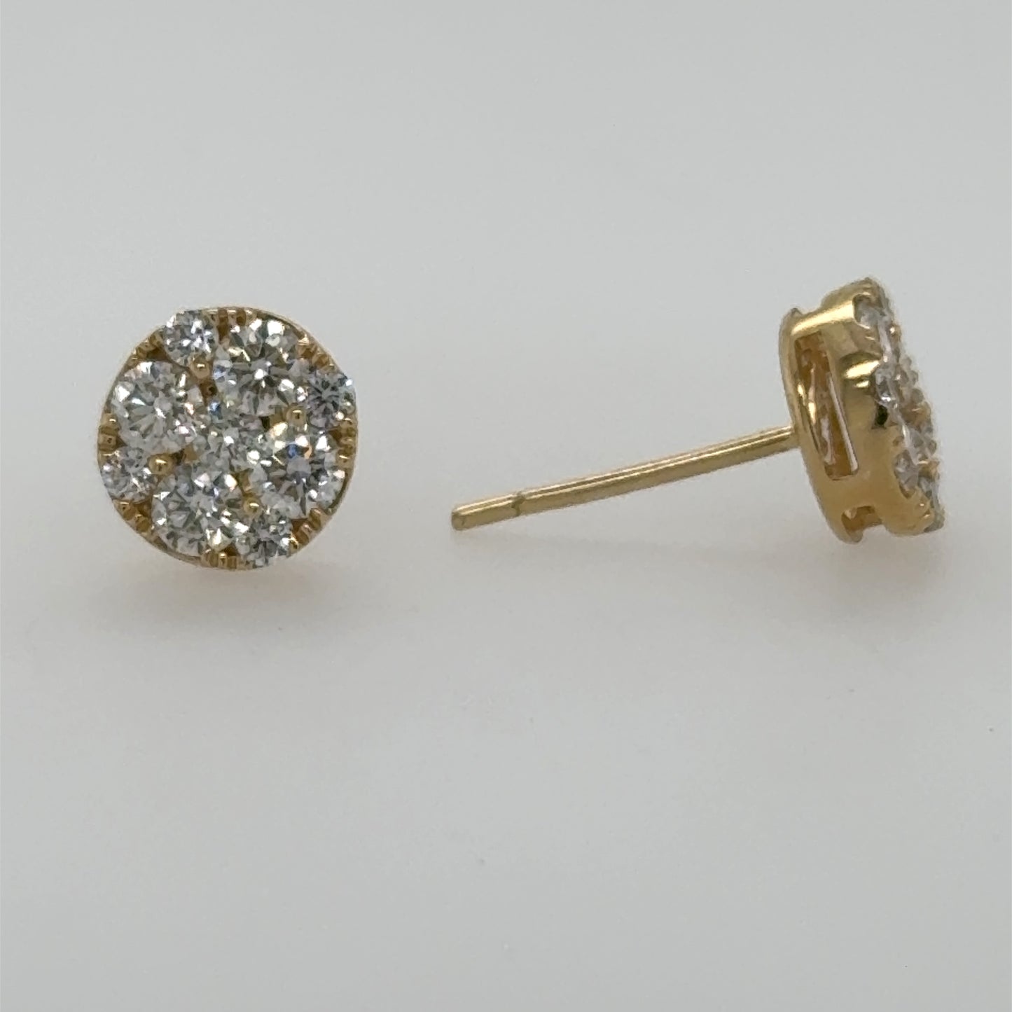 14K yellow gold stud earrings with round diamond cluster and friction posts.