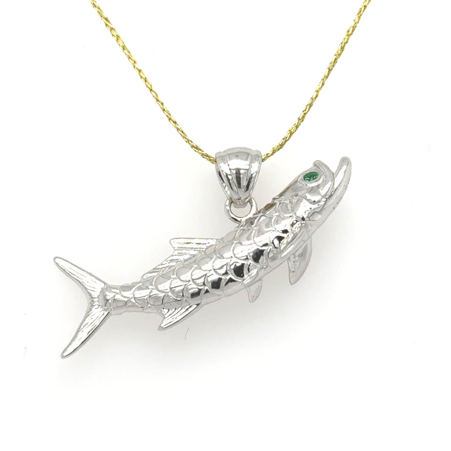 14K white gold tarpon pendant with textured scales and green emerald eye.