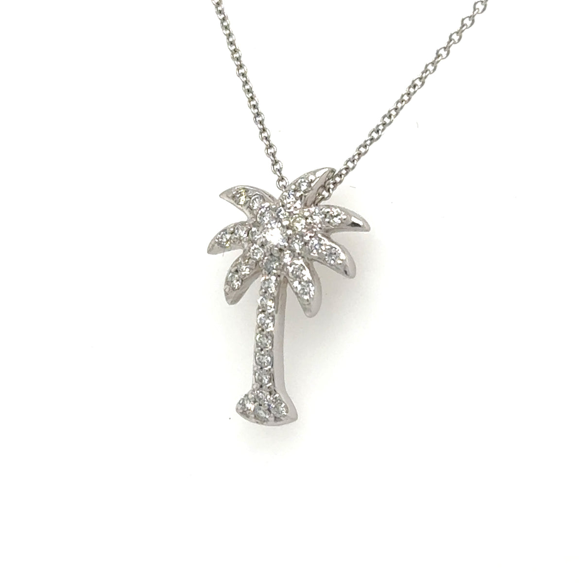 White gold palm tree pendant pavé-set with round diamonds on a fine chain.