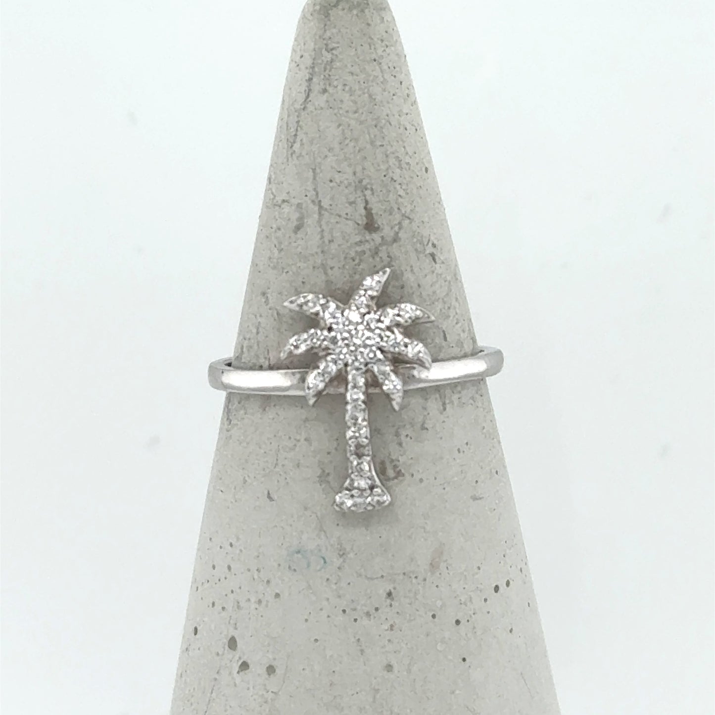 14K white gold ring with a pavé diamond palm tree motif on slim band.