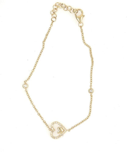 Yellow gold bracelet with diamond pavé heart charm, bezel diamond accents, lobster clasp.