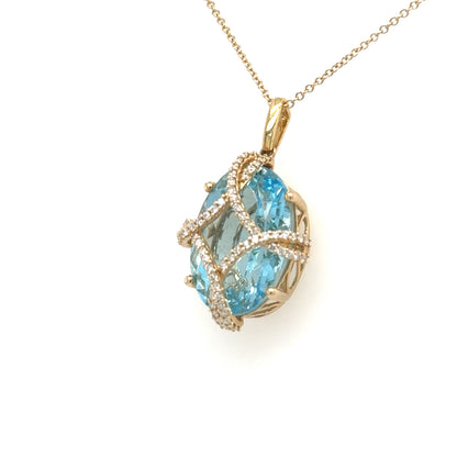 14K yellow gold pendant with oval Swiss blue topaz and diamond lattice cage.