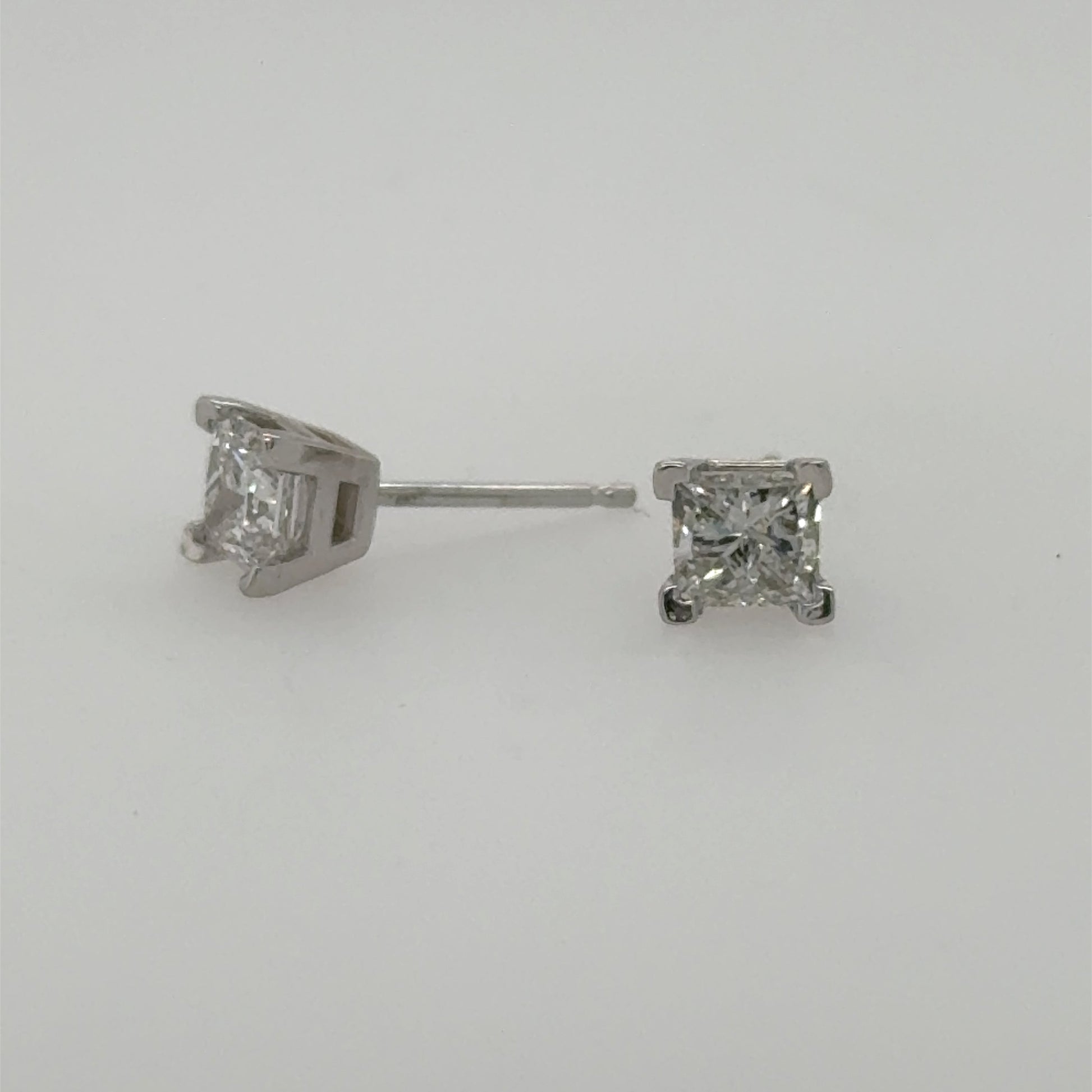14K white gold stud earrings with princess-cut diamonds in four-prong settings.