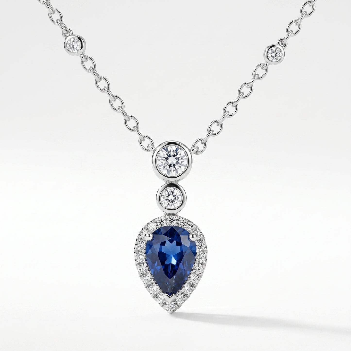 18K White Gold Pear Sapphire & Diamond Halo Pendant Necklace