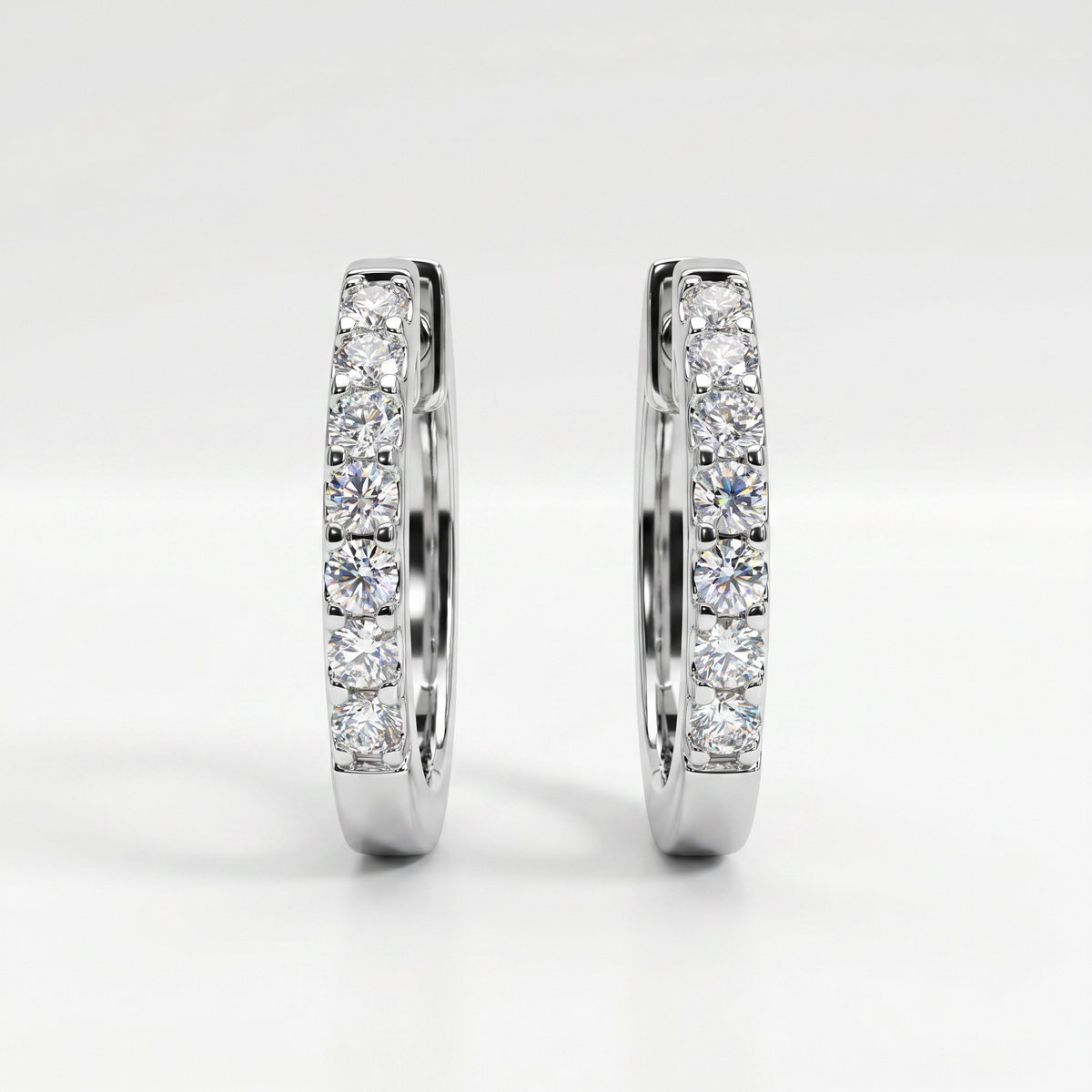 14K White Gold Diamond Huggie Earrings - 0.08ctw Round Cut