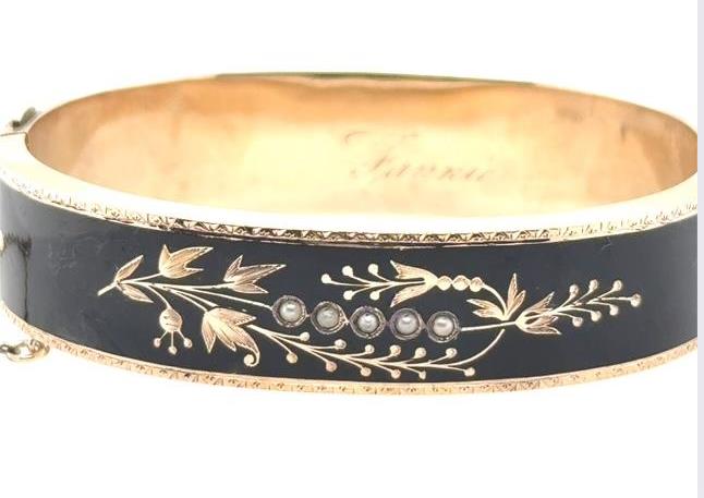 10K yellow gold bangle with black enamel, floral engraving, and five seed pearls.