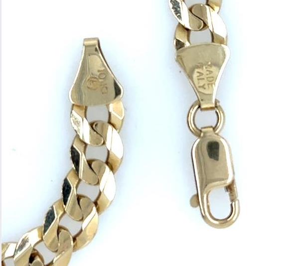 10K yellow gold concave curb link bracelet with lobster claw clasp.