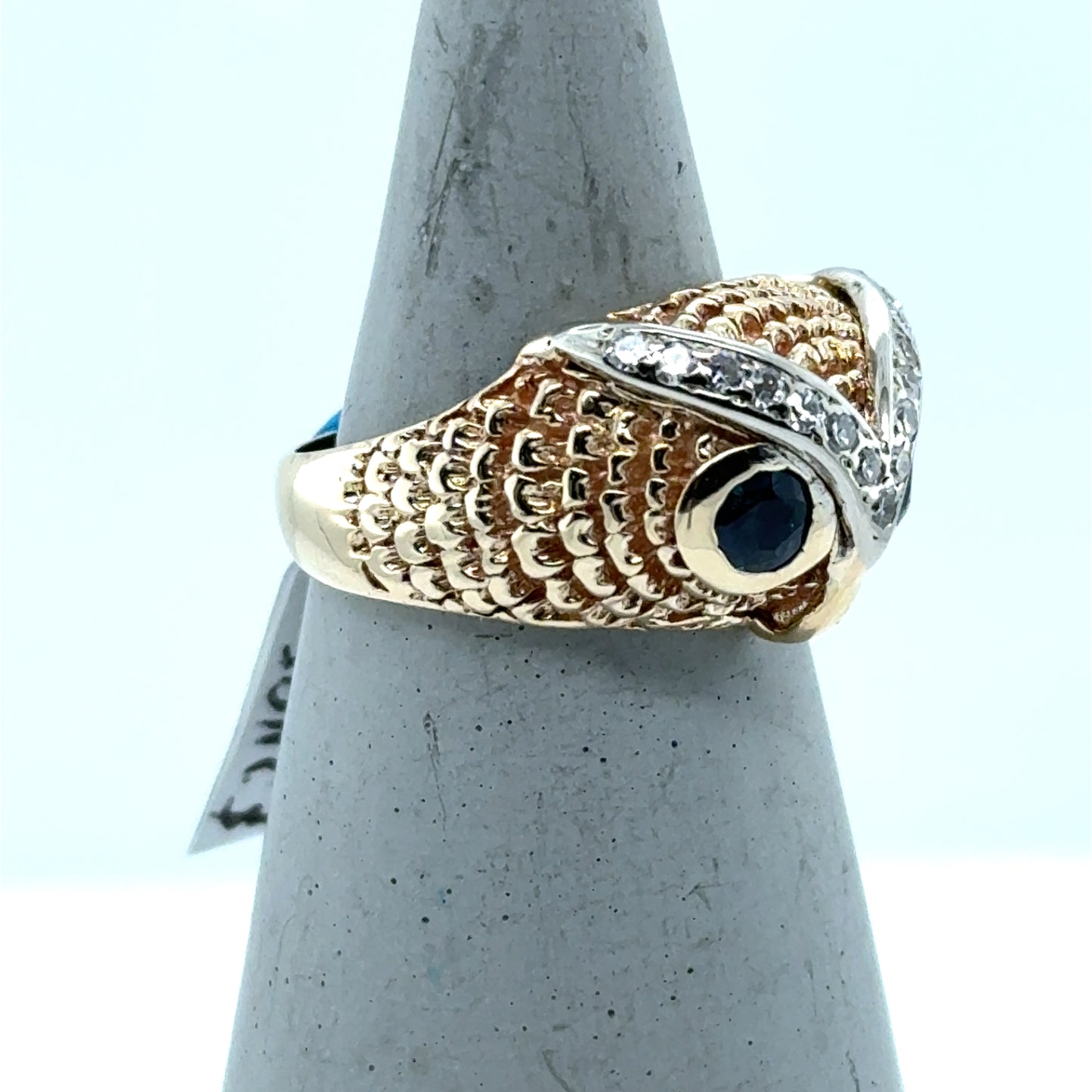 14K yellow and white gold owl ring with blue topaz eyes and diamond eyebrows.