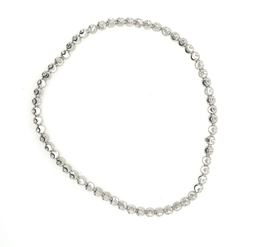 14K white gold diamond-cut bead bracelet on stretch cord, clasp-free design.