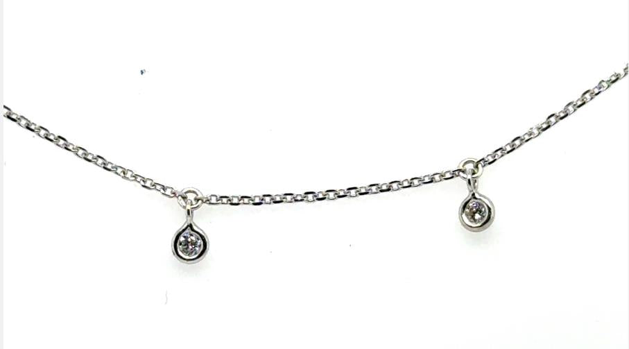 White gold cable chain anklet with small bezel-set diamond dangles.