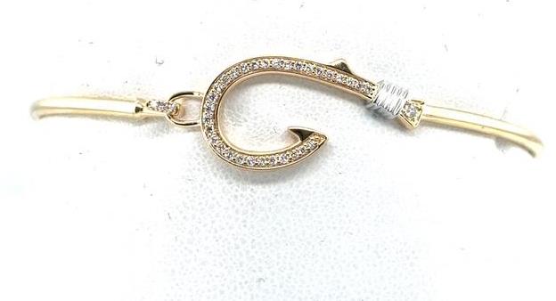 14K yellow gold bangle with diamond‑paved fish hook motif and white accents.