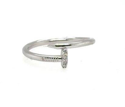 White gold nail-shaped ring with small round diamonds on the nail head.