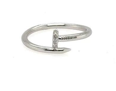White gold nail-shaped ring with pavé-set round diamonds on the nail head.