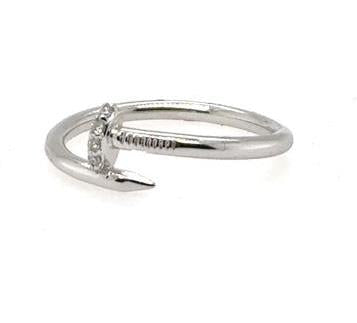 White gold nail-motif ring with small round diamonds on the head and shank.