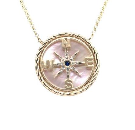 14K yellow gold compass rose pendant with mother-of-pearl, sapphire center, diamond accents.