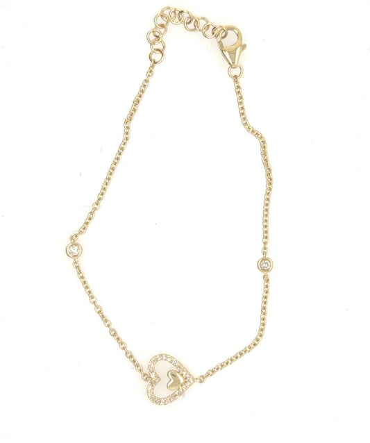 Yellow gold bracelet with diamond pavé heart charm, bezel diamond accents, lobster clasp.