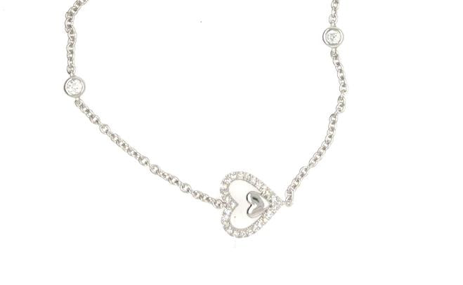 14K white gold bracelet with diamond pavé heart charm and bezel-set accents.