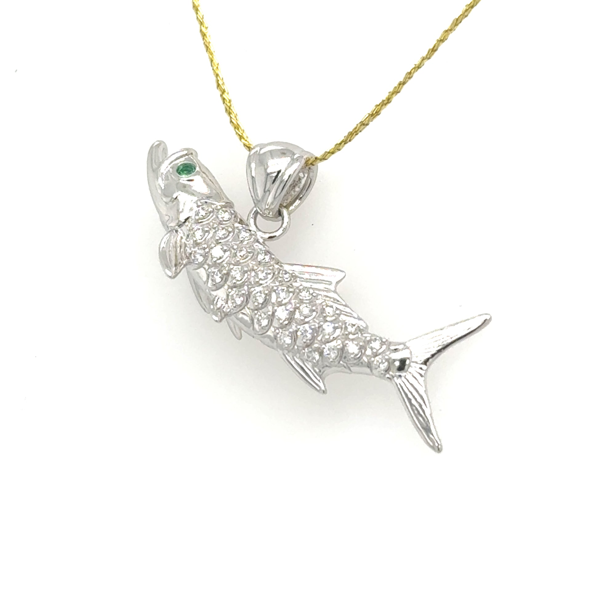 14K white gold tarpon pendant with pavé diamonds and an emerald eye.