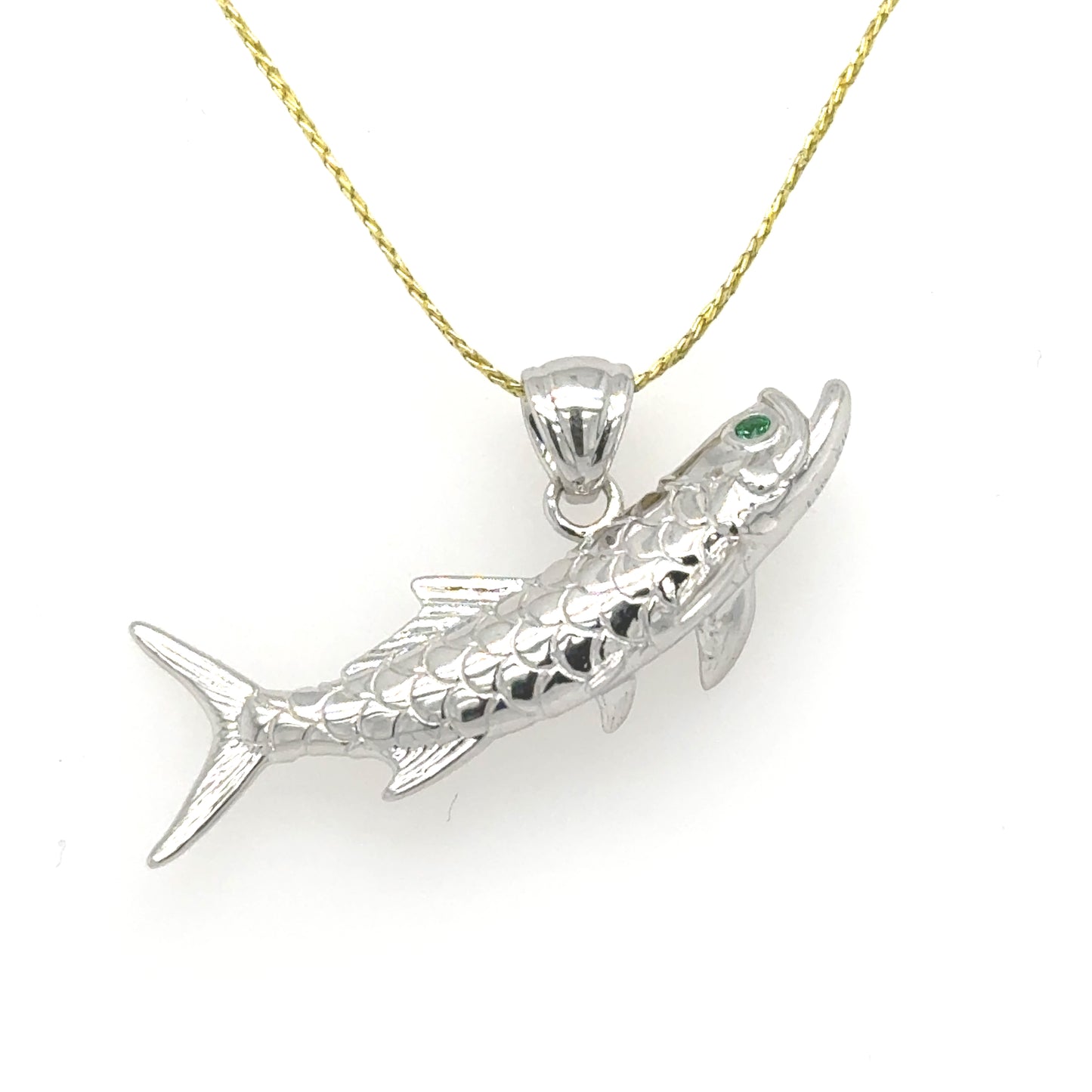 14K white gold tarpon pendant with textured scales and green emerald eye.