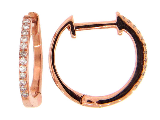 Small 14K rose gold huggie hoops with a single row diamonds.