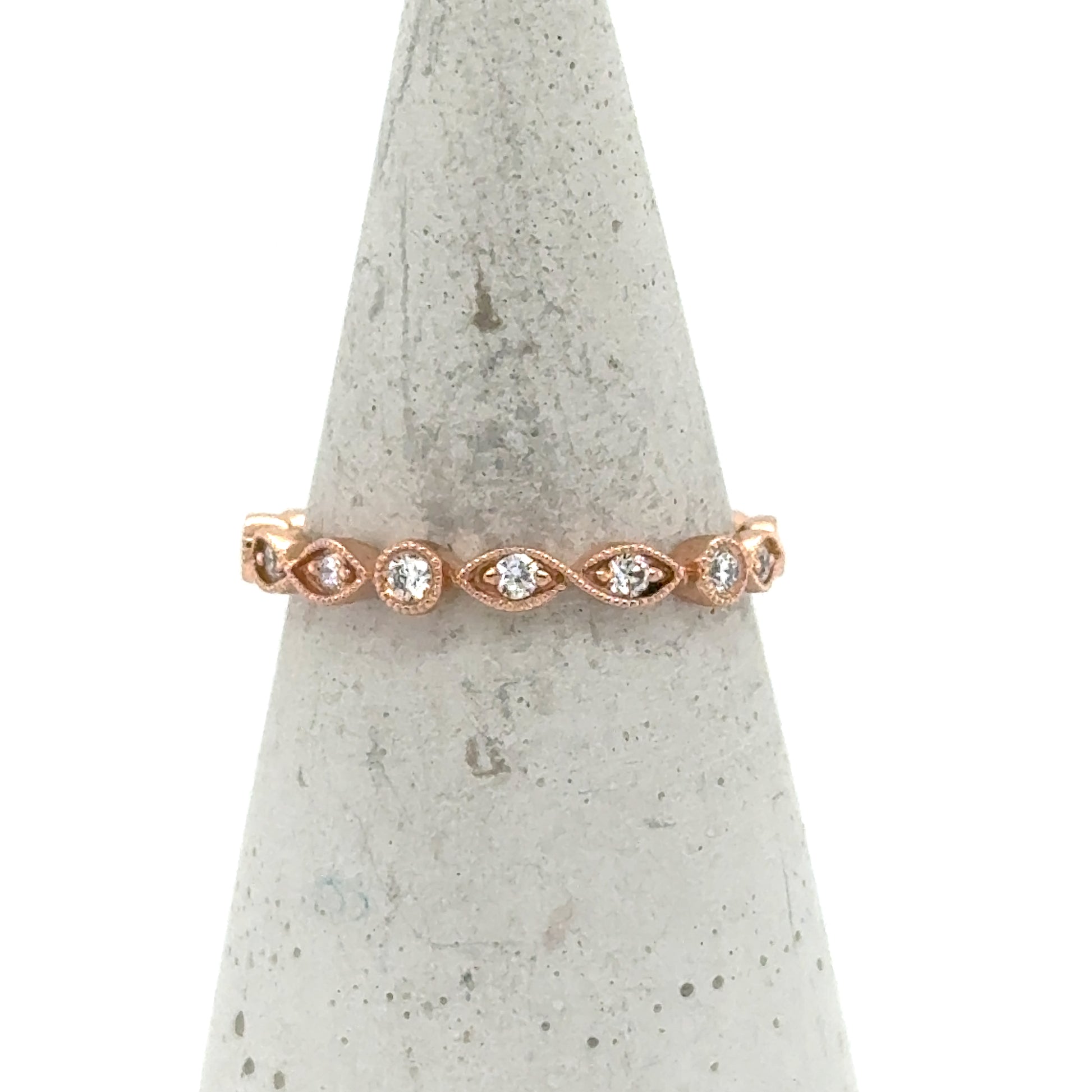 14K rose gold stackable band with alternating marquise and round diamond bezels.