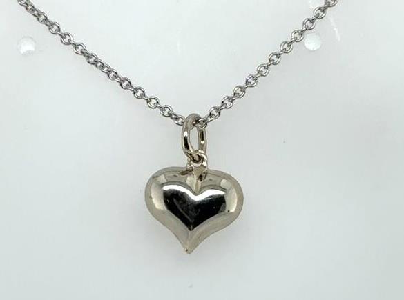 Petite puffed heart pendant in polished white gold on a delicate cable chain.