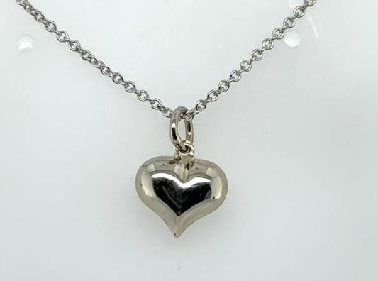 Petite puffed heart pendant in polished white gold on a delicate cable chain.