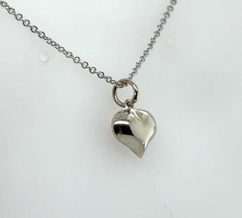 14K white gold petite puffed heart pendant on diamond-cut cable chain.