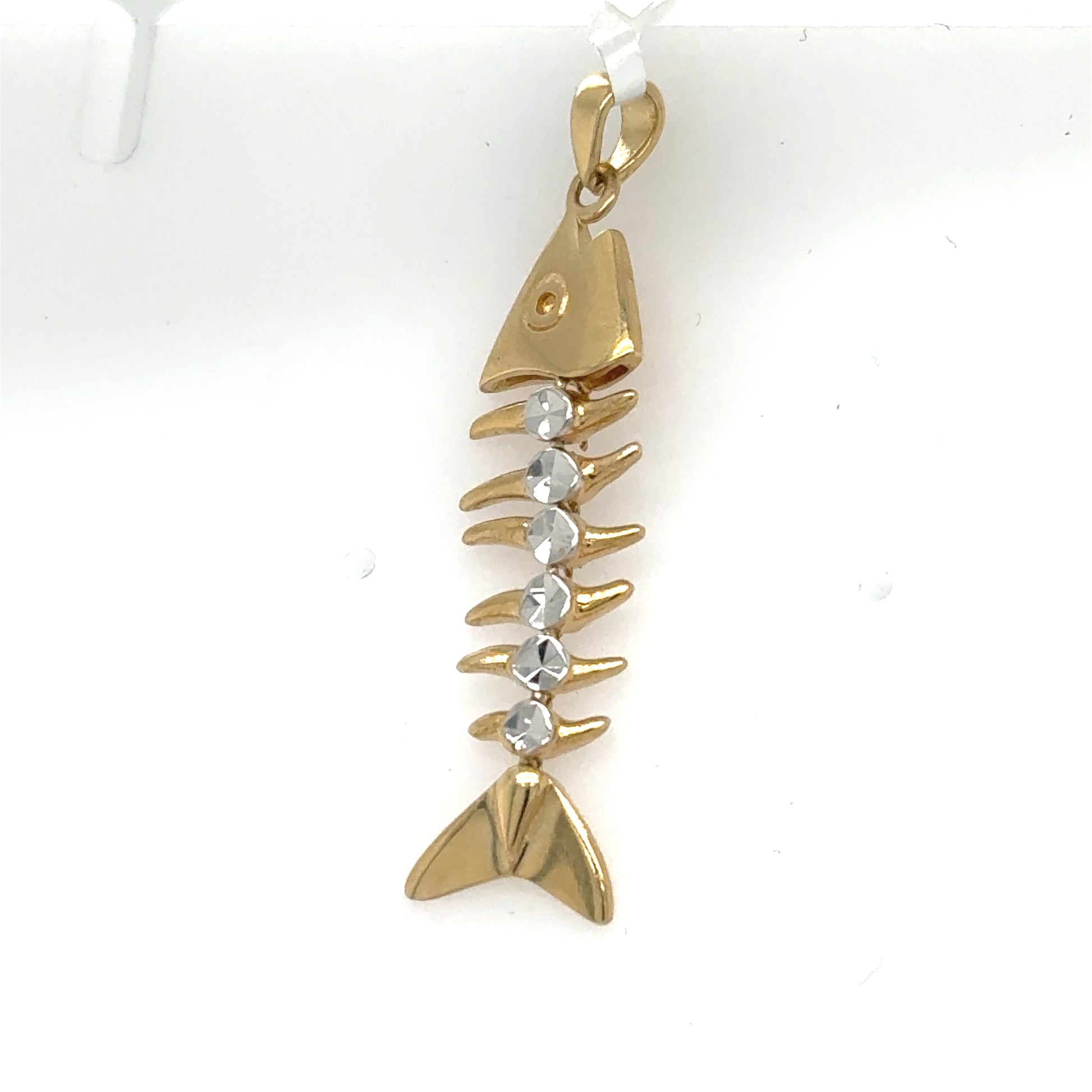 14K two-tone bonefish skeleton pendant with gold head and tail, rhodium-accented spine.