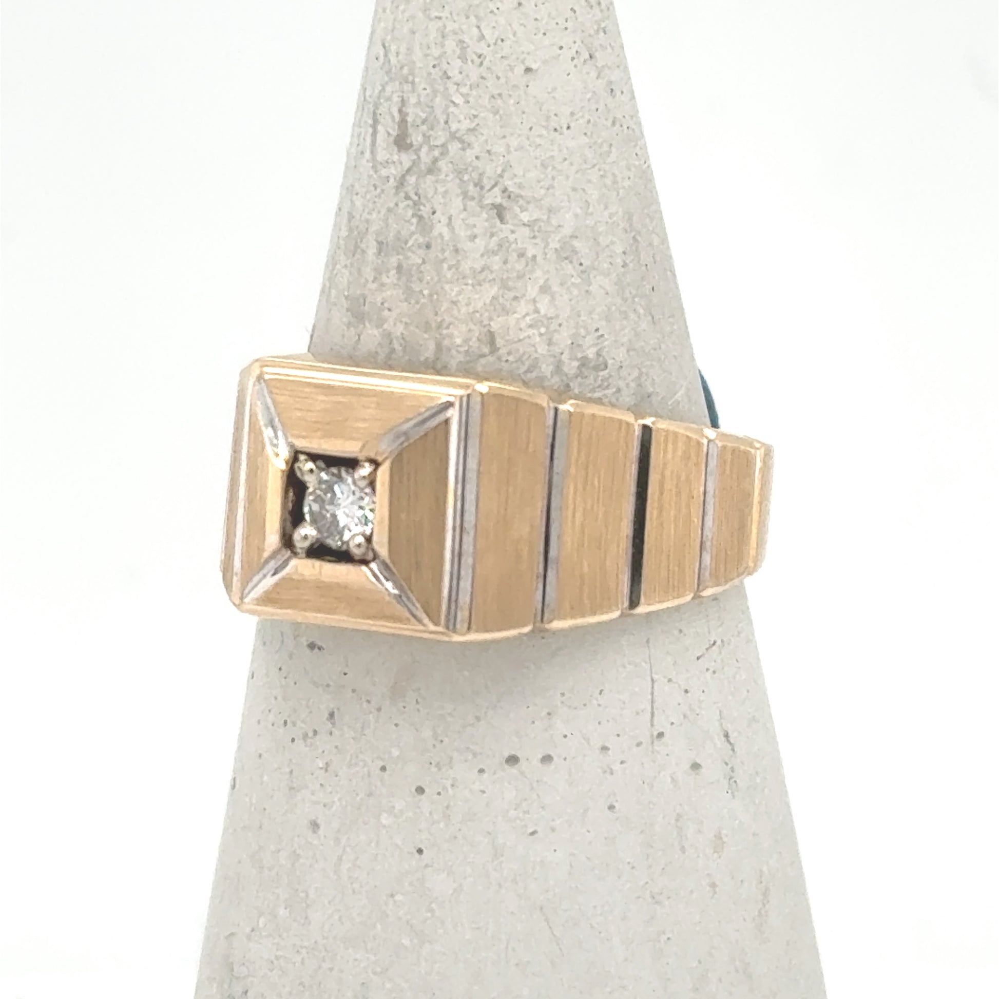 14K two-tone men’s ring with square top and prong-set round diamond.