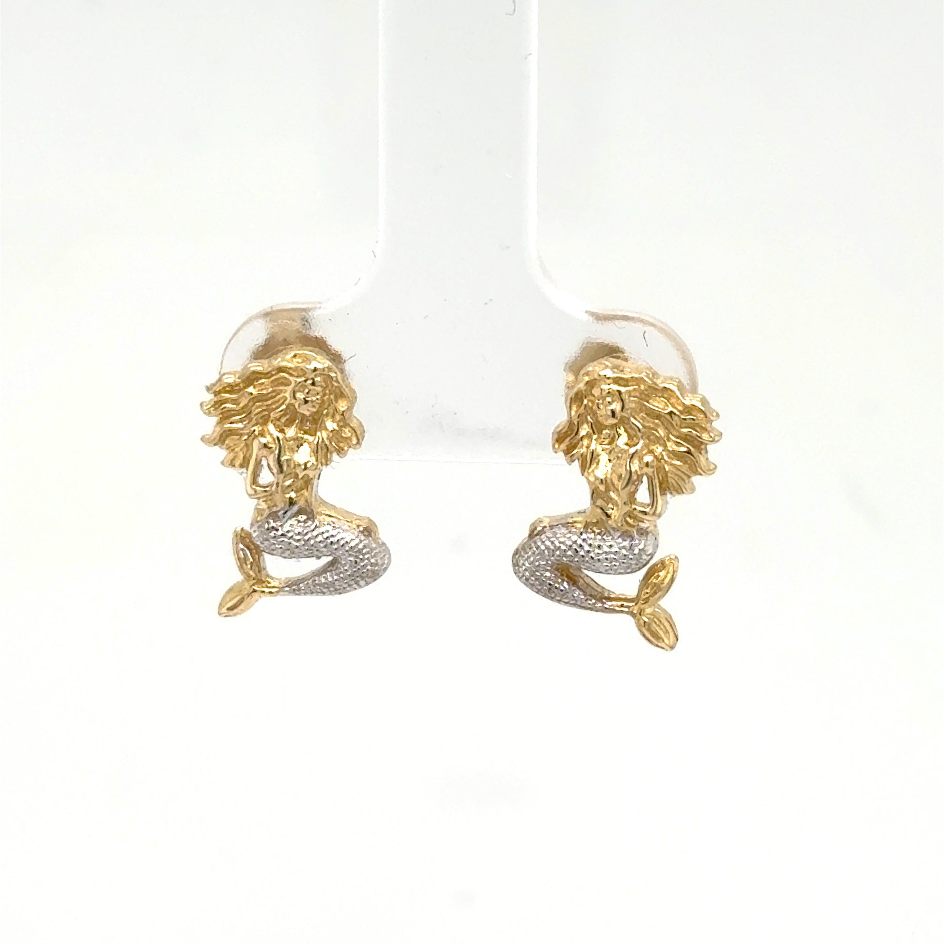 Small 14K two‑tone mermaid stud earrings with yellow gold bodies and rhodium‑plated silver tails.