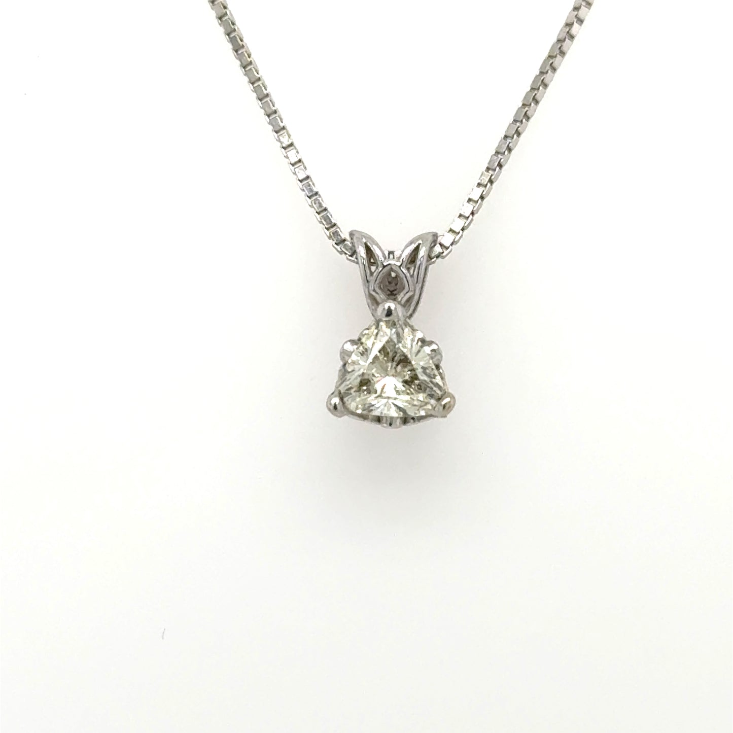 14K white gold pendant with trillion‑cut diamond in three‑prong basket and rabbit‑ear bail.