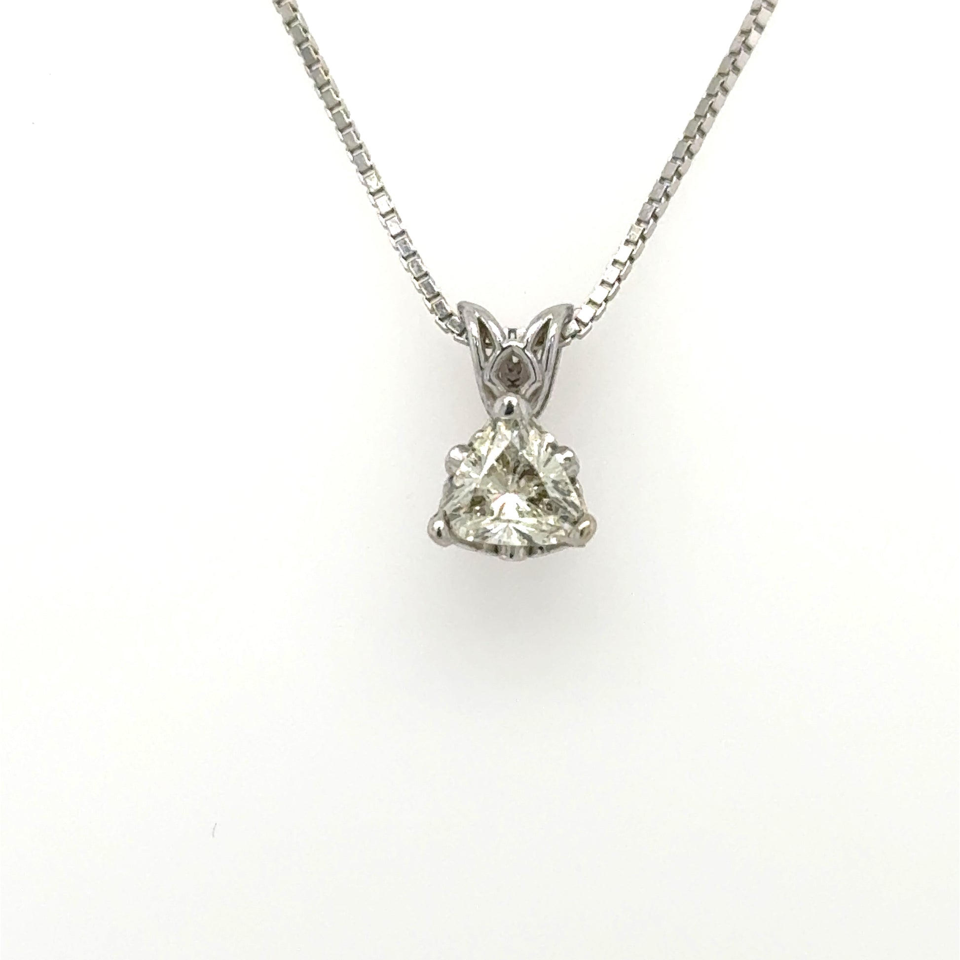 14K white gold pendant with trillion‑cut diamond in three‑prong basket and rabbit‑ear bail.