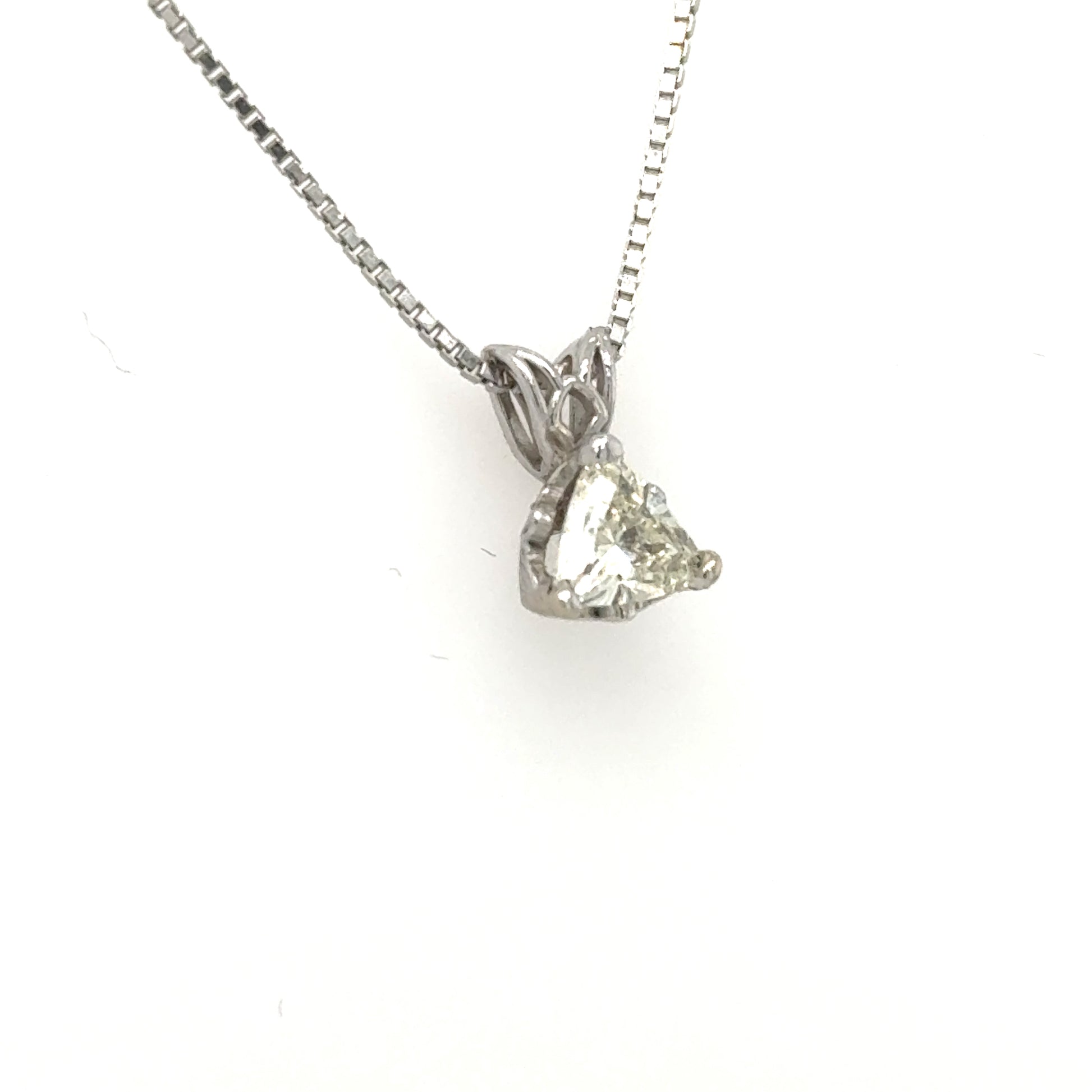 14K white gold pendant with trillion-cut diamond in three-prong basket and rabbit-ear bail.