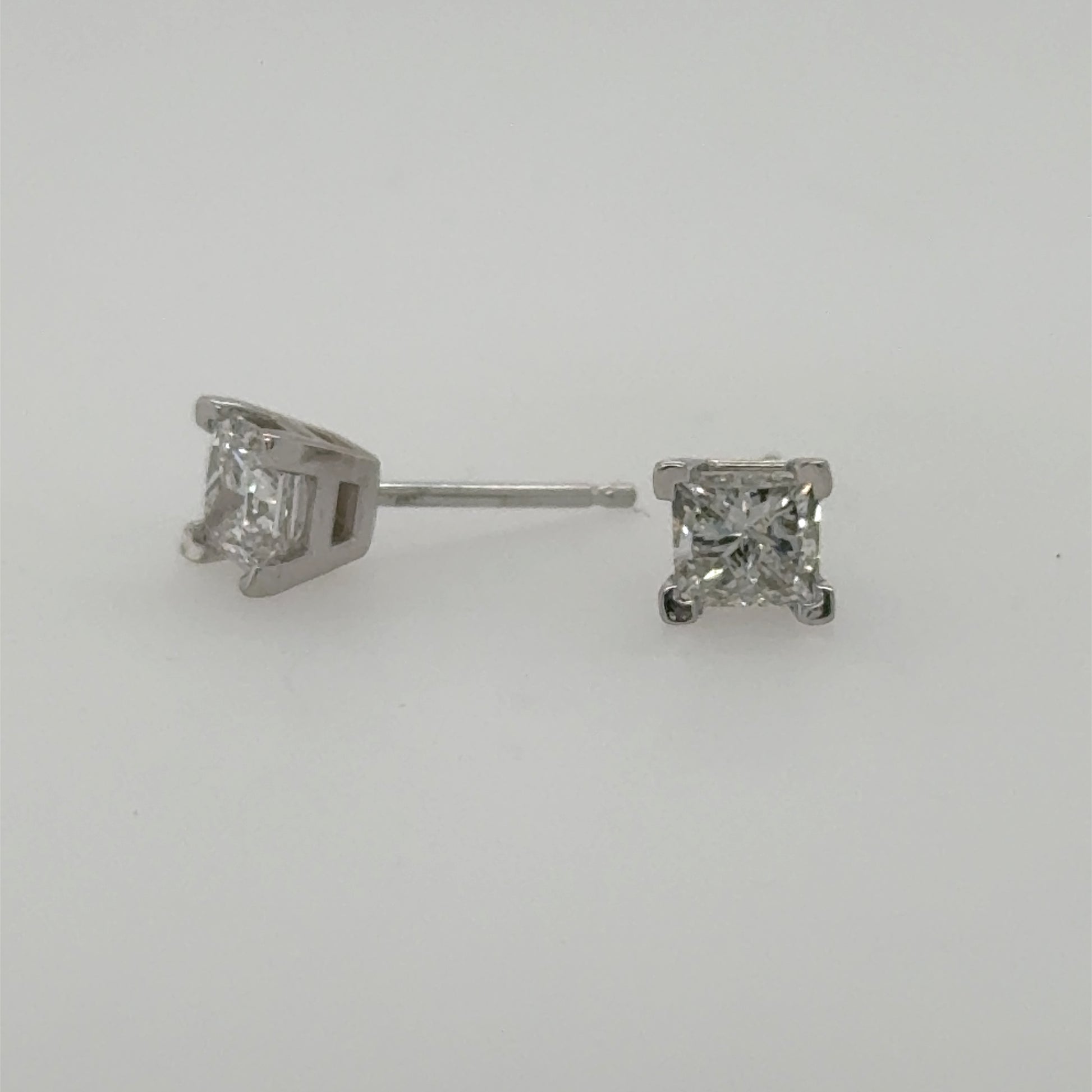 14K white gold stud earrings with princess-cut diamonds in four-prong settings.