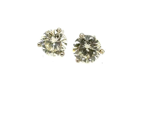 Round brilliant diamond stud earrings in 14K white gold three-prong settings.