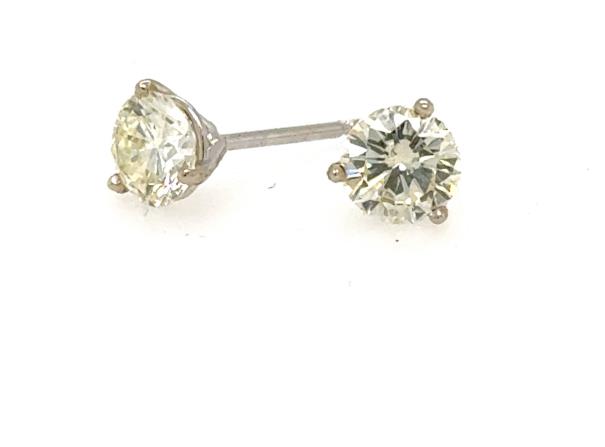 Round brilliant diamond stud earrings in white gold three-prong martini settings.