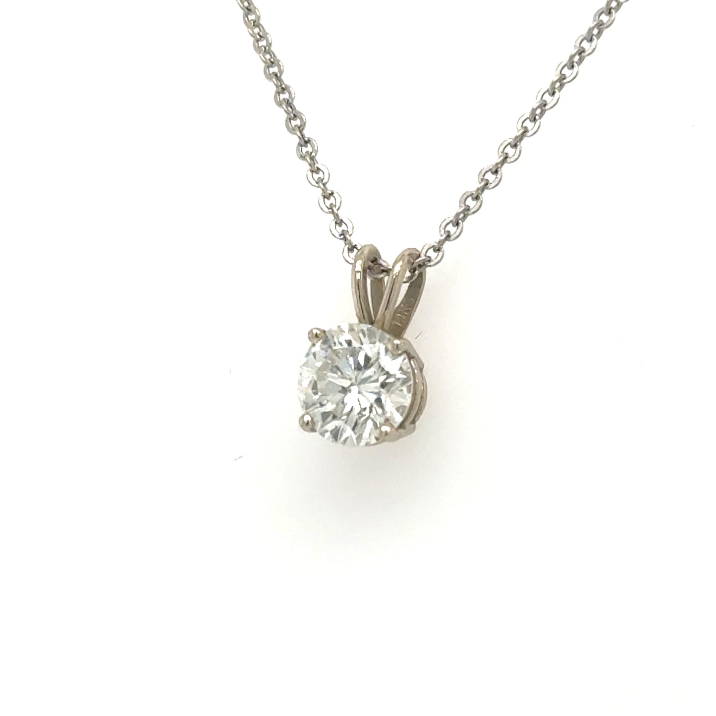 Round brilliant diamond solitaire in 14K white gold four-prong basket with rabbit‑ear bail.