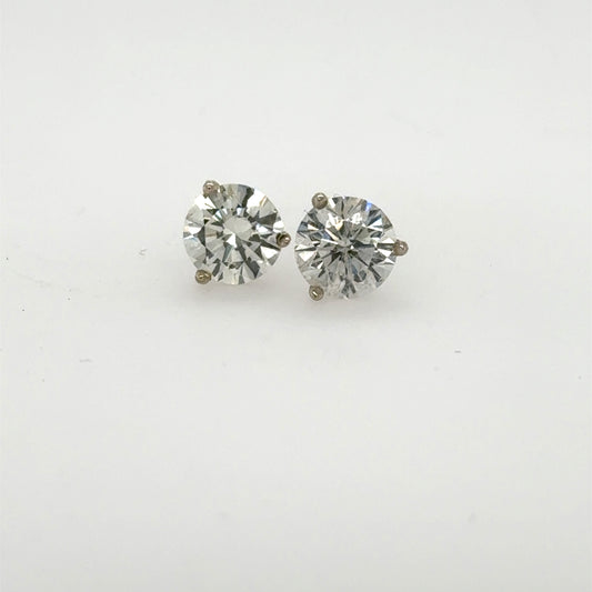 Round brilliant diamond stud earrings in 14K white gold three-prong martini settings.