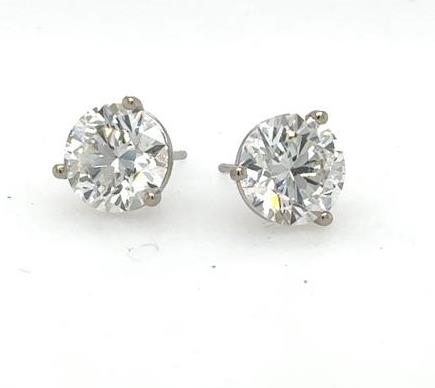 Round lab-grown diamond stud earrings in 14K white gold three-prong martini settings.