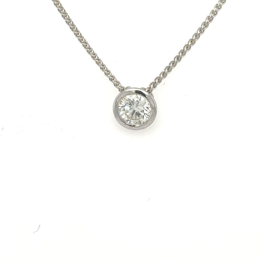 Round brilliant diamond bezel-set in white gold on a wheat chain.