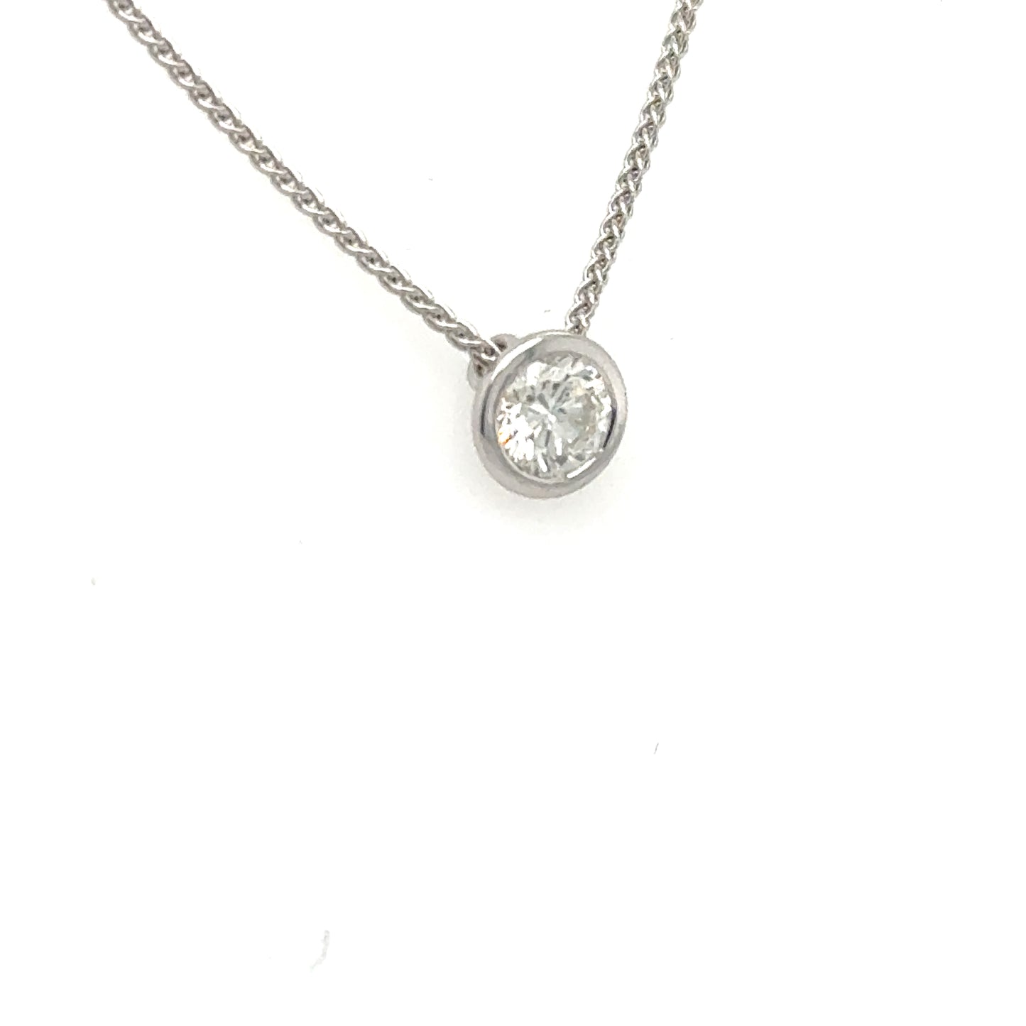 White gold necklace with round brilliant diamond in a petite bezel pendant.