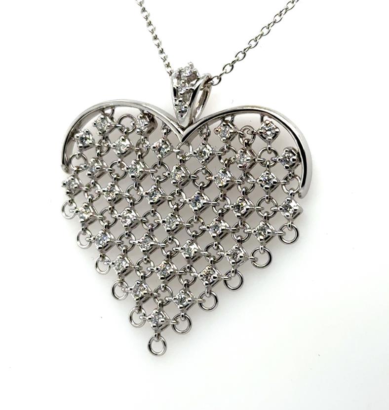 14K white gold chainmail heart pendant with round diamonds on rolo chain.