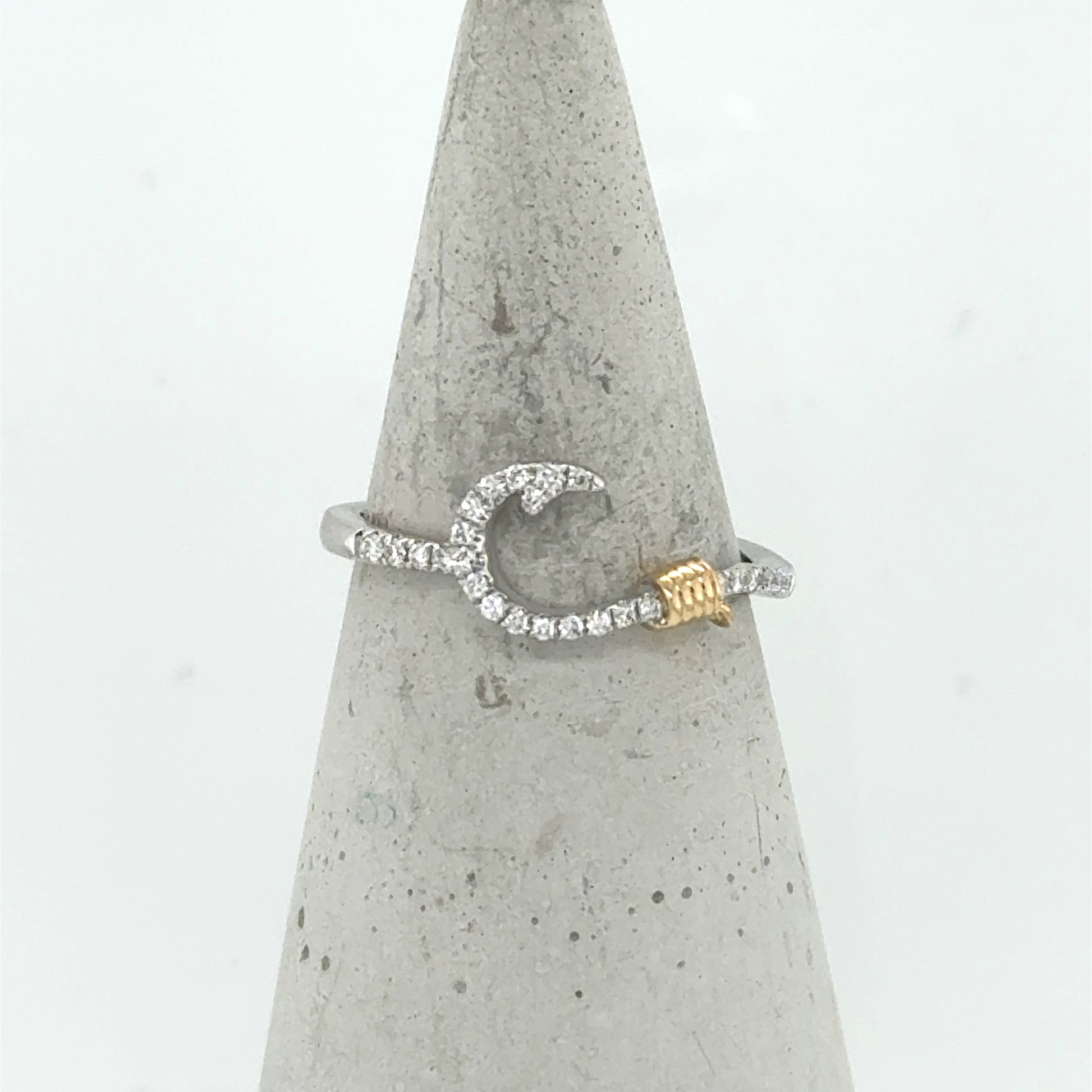 14K white gold ring with diamond fish hook motif and yellow gold rope accent.
