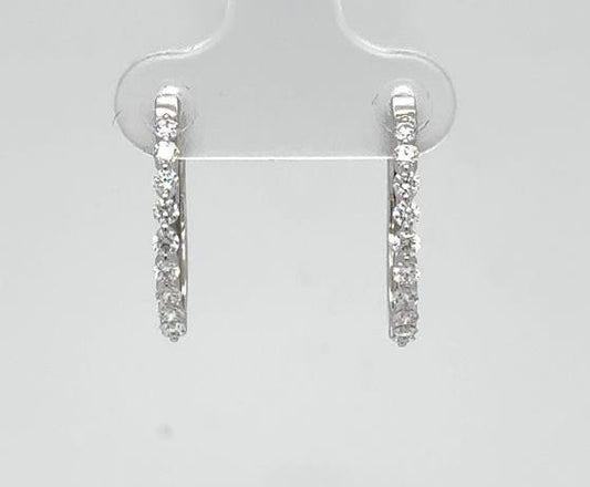 14K white gold hoop earrings with round diamonds in shared-prong settings.