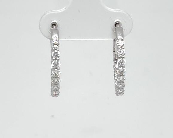 14K white gold oval hoop earrings with inside-out prong-set round diamonds.