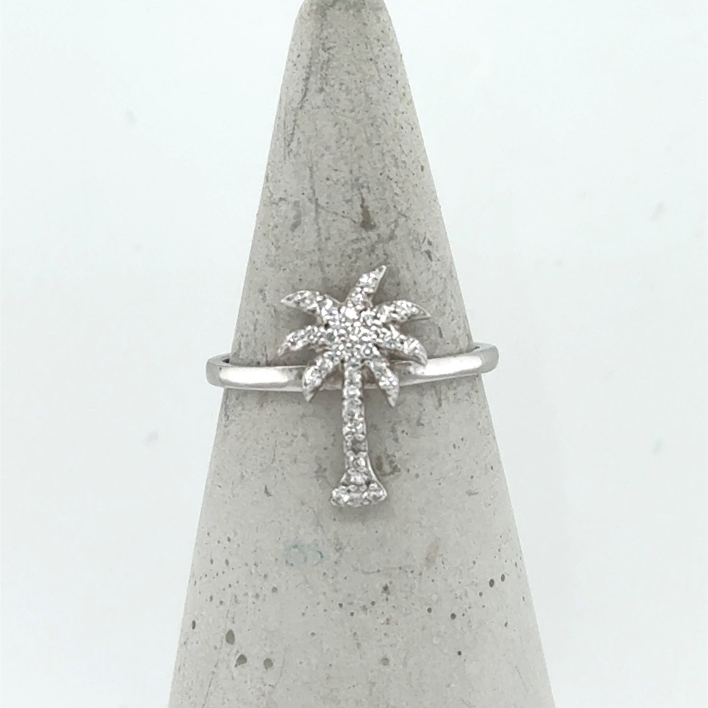 14K white gold ring with a pavé diamond palm tree motif on slim band.