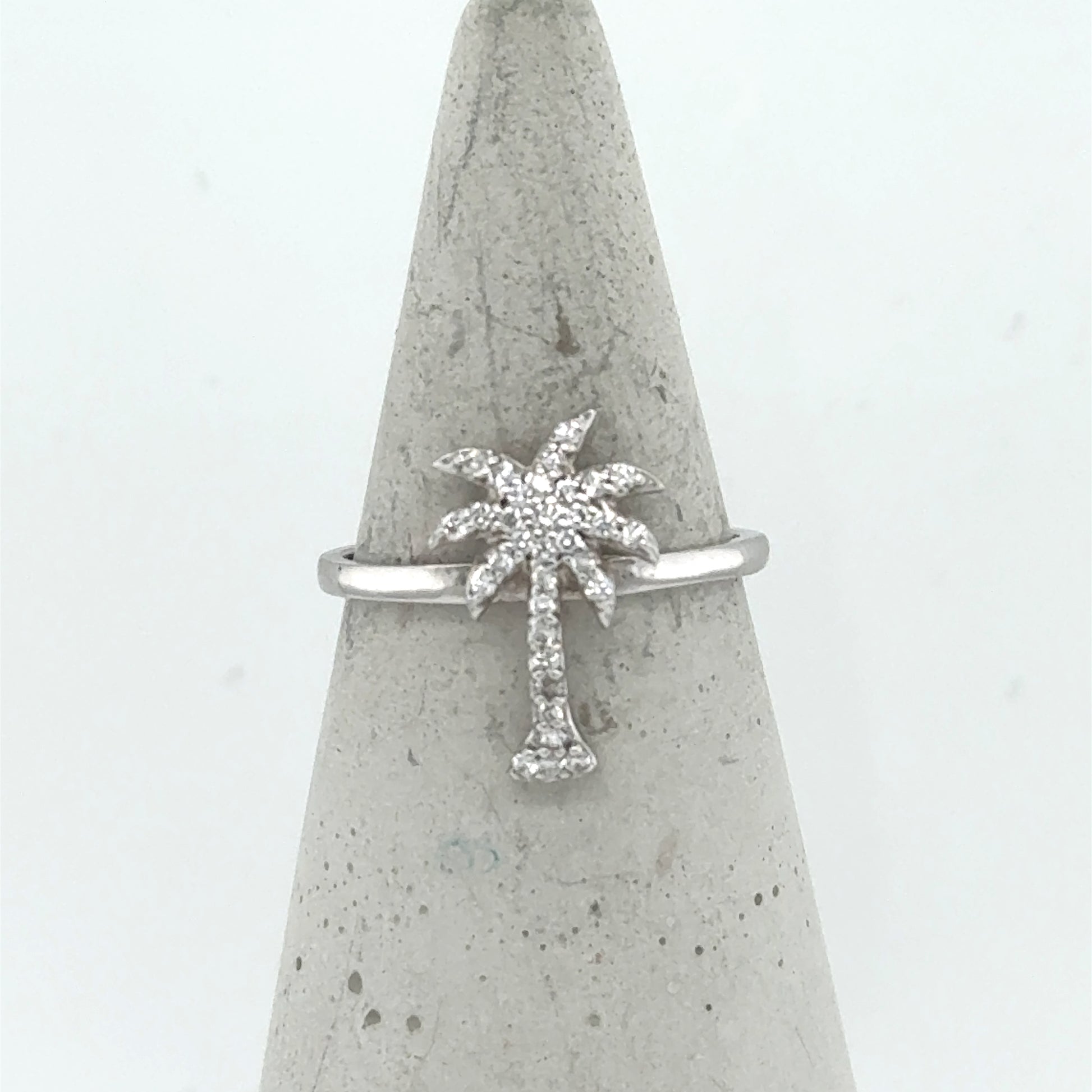 14K white gold ring with a pavé diamond palm tree motif on slim band.